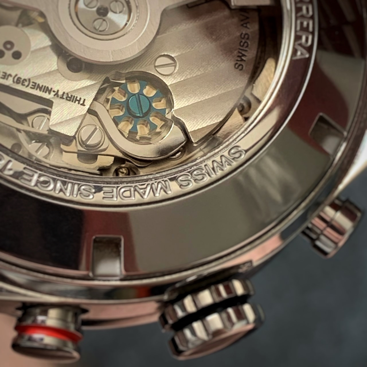 Carrera caseback showing multiple watch finishing techniques and the chronograph complication