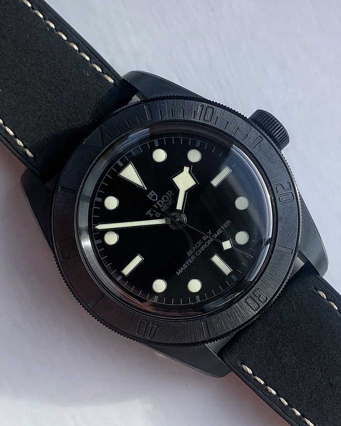 Tudor Black Bay Ceramic flat lay